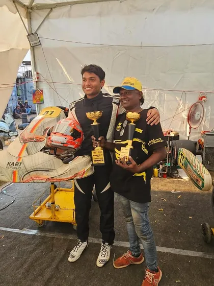 A driver and his mechanic celebrating a double podium finish at the Meco Meritus Cup 2024.