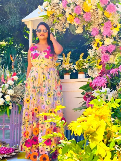 Posing against a beautiful floral arch at a Haldi ceremony. The decor at these events is always so vibrant, and I love being a part of such a picturesque setting.
