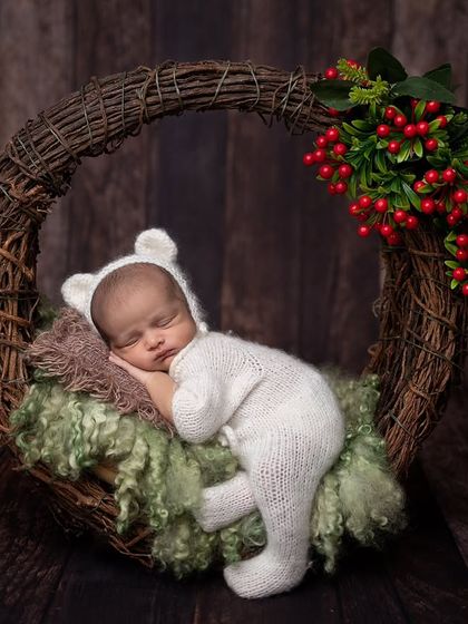 A clean, simple version of the winter wreath pose without the heart prop, focusing on the natural textures and colors.