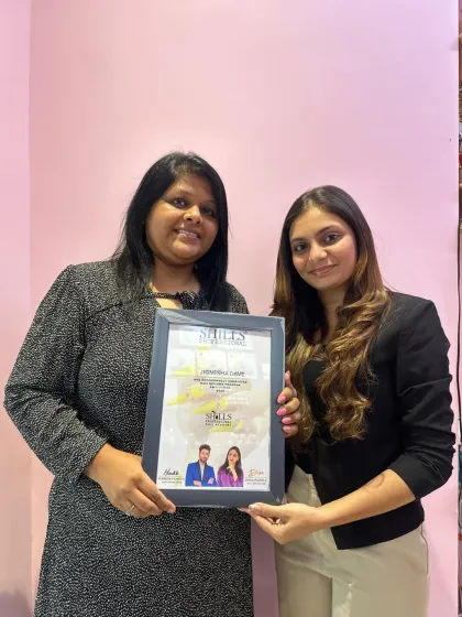 Another student proudly holding her Shills Professional certificate. Her journey from learning to certification is what our academy is all about.