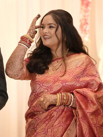 A candid shot of the bride during her reception.