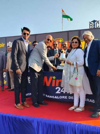 The trophy presentation for the Winfair247 Bangalore Derby (Grade 1). This is a prime opportunity for sponsor representatives to network with horse owners, trainers, and other influential guests.
