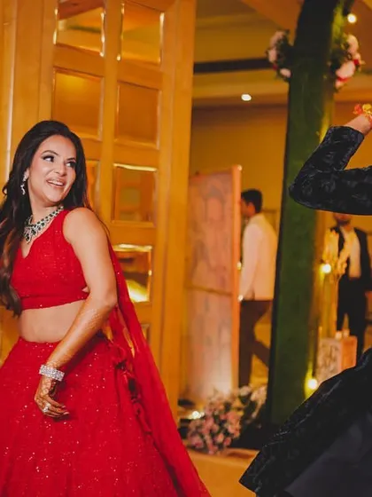 The look of pure joy on the couple's faces as they make their choreographed sangeet entrance. We make sure your first moments are full of fun.