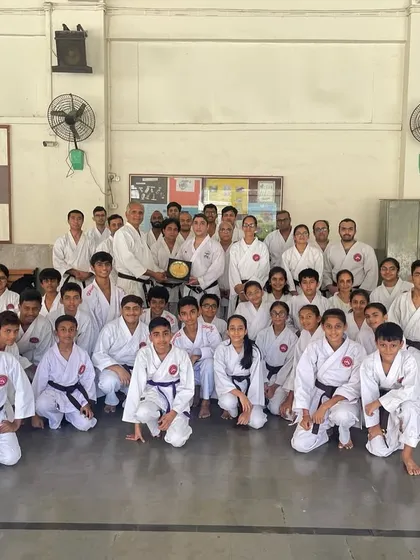 Our senior students and instructors with Sensei Kaivan Fatakia after a seminar on WKF tournament rules and training. Continuous learning is key to staying competitive.