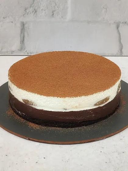 The full Tiramisu Cheesecake, dusted with cocoa powder. It’s a sophisticated choice for dinner parties or when you just need a coffee-flavored pick-me-up.