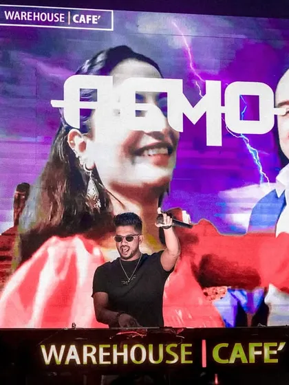On the mic at Warehouse Cafe, Nagpur, with custom visuals on the screen. I love incorporating pop culture into my sets.