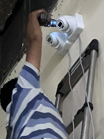Final adjustments being made to the dual-camera mount. We ensure the cameras are perfectly angled before completing the installation.