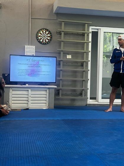 A coach shares his perspective during a wellness workshop. These sessions are for everyone, as we believe in growing together as a team.