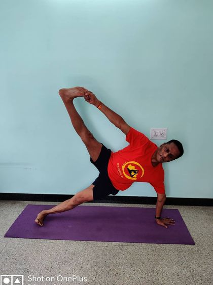 Vasisthasana (Side Plank Pose) with the top leg lifted. This variation adds a significant challenge to the core and requires excellent balance and oblique strength.