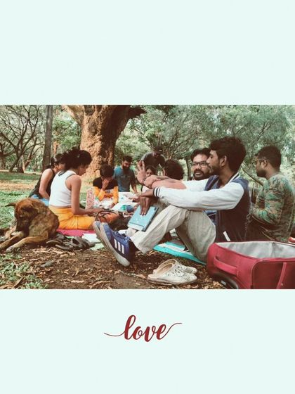 Love. A single word that captures the entire experience. A dog rests peacefully as people connect, share, and create together.