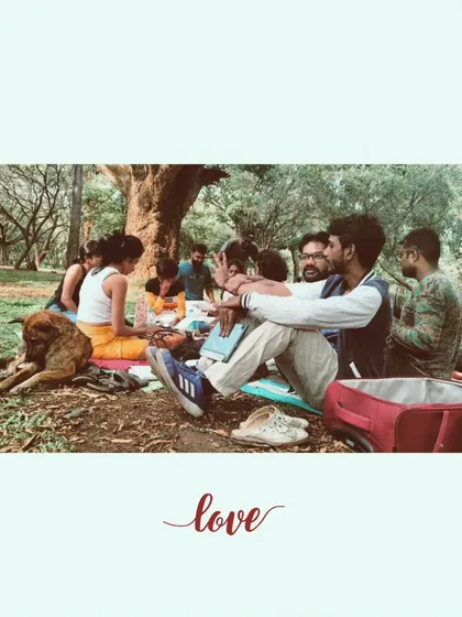 Love. A single word that captures the entire experience. A dog rests peacefully as people connect, share, and create together.