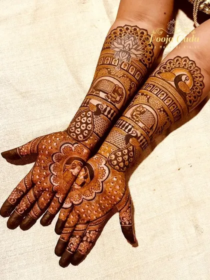A gorgeous design for an NRI bride from Ireland, featuring beautiful peacocks, elephants, and lotus motifs for a classic and royal bridal look.