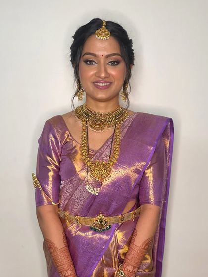 A full smile shows how the makeup moves with the bride's expressions, never looking stiff or heavy. The goal is always a comfortable, breathable finish.