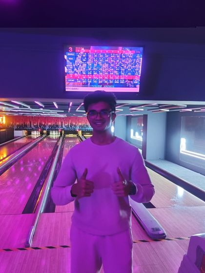 A winner from our Republic Day giveaway, all smiles at the bowling alley.