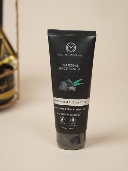 I include high-quality grooming products like The Man Company's Charcoal Face Scrub in my hampers for him.