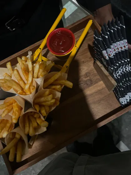 For a Halloween-themed party, we served fun appetizers like these french fries in paper cones. The presentation adds to the playful and spooky vibe of the event.