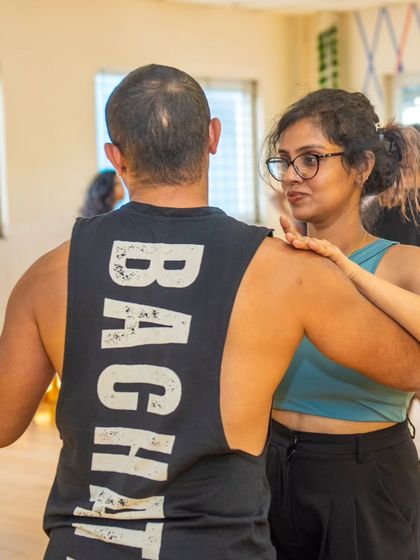 A close up of the connection in a Bachata hold. It's all about the subtle communication between the lead and follow.