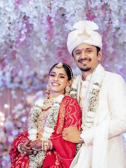 A classic wedding portrait of Nupur and Chinmay, perfect for the family album. Posed against a beautiful floral backdrop, this shot captures their shared happiness and the grandeur of their special day. I always ensure we get these timeless shots.