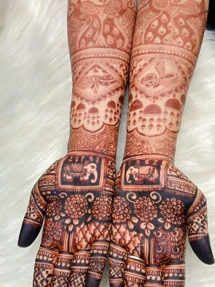 A beautiful stain result on a full bridal mehendi, showcasing the clarity of the intricate floral and elephant patterns.