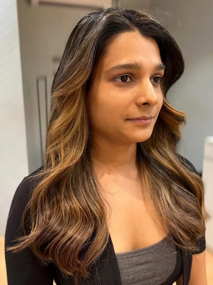 A close-up of the face-framing balayage, showing how it brightens her features.