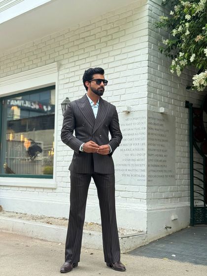 The definitive power suit. Our double-breasted pinstripe design is a wardrobe essential for the modern gentleman.