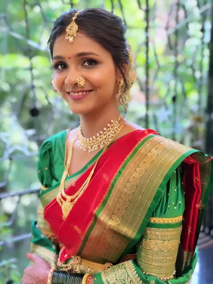 Capturing the timeless beauty of a Maharashtrian bride. This look features traditional elements and a focus on radiant skin, ensuring she looks and feels her absolute best on her special day.