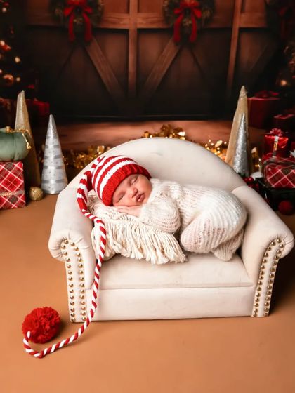 The cutest little Christmas elf. I love creating seasonal and festive setups to celebrate the time of year your baby was born.