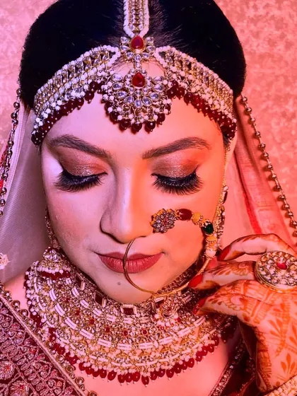 A close-up of this bride's makeup, focusing on the soft glam eyeshadow and the full, feathery eyelash extensions that define her eyes.