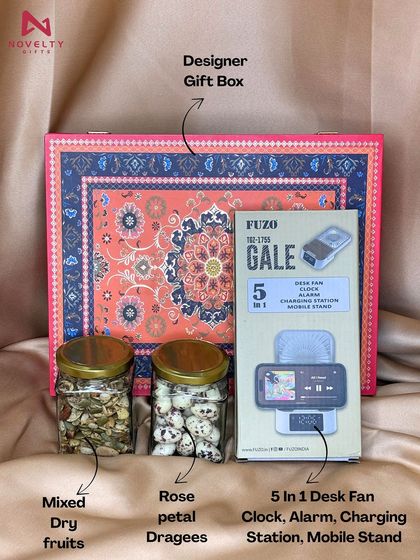 This hamper combines a useful gadget with tasty treats. It includes a 5-in-1 desk fan, jars of mixed dry fruits and rose petal dragees, all packed in a beautiful designer gift box.