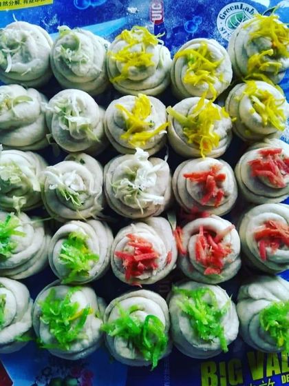 A close-up of colorful steamed buns or dumplings. These bite-sized appetizers are part of my pan-Asian vegetarian offerings, adding a unique flavor to the menu.