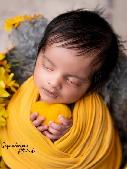 A duplicate of image 233, a cozy and cheerful newborn portrait.