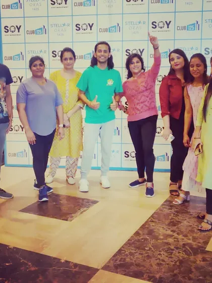 A happy group photo after a weekly Zumba class. Building a consistent wellness routine helps maintain high morale and keeps the team spirit strong.