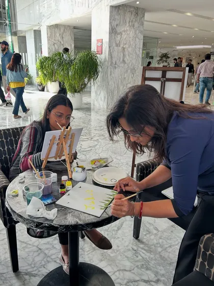 One of my favorite parts of any workshop is connecting with you one-on-one. Here I am helping a participant with her technique, ensuring everyone feels supported and confident, no matter their skill level.