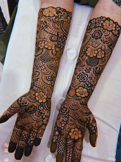 Another angle of the engagement mehendi, showing how beautifully it covers the hands and arms.