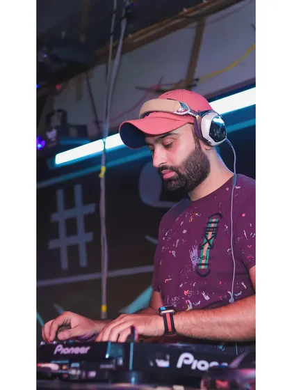 A close-up showing my focus while mixing. Every track transition and sound adjustment is carefully considered.