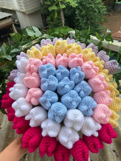 A rainbow tulip bouquet, with rows of different colored tulips creating a beautiful effect.