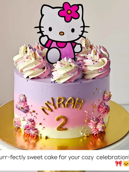 Purr-fectly sweet! This Hello Kitty cake features a lovely purple and pink ombre design, topped with the iconic character for a second birthday.
