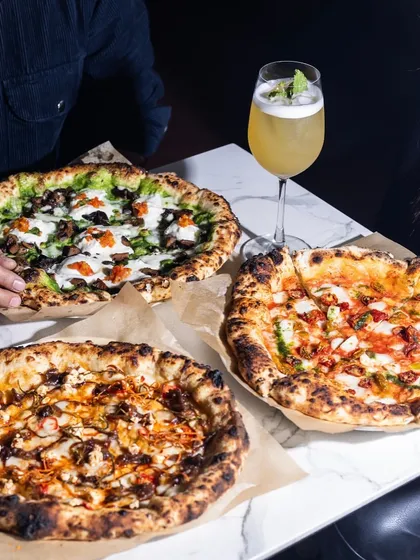 Why settle for one pizza when you can have a feast? This is what happy tables look like at Camillo's, sharing different flavors from our wood-fired oven.