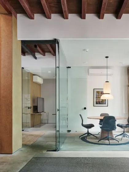 Transparent glass walls and a large arched window allow our conference room to be visually connected to the rest of the office, while a warm timber ceiling adds a welcoming touch.
