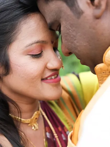 An intimate close-up of Vrushali and Swapnil, their foreheads touching in a moment of quiet connection during their engagement photoshoot.