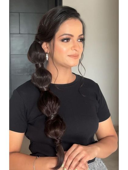 A close-up of a bubble braid. This fun and playful style is a great alternative to a classic braid and always gets a lot of compliments.