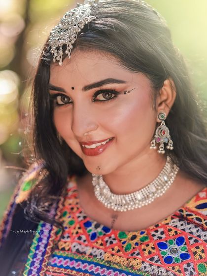 A vibrant and energetic series celebrating Navratri. The model is dressed in colorful Garba attire, and the photos capture the festive spirit through dynamic poses and joyful expressions.