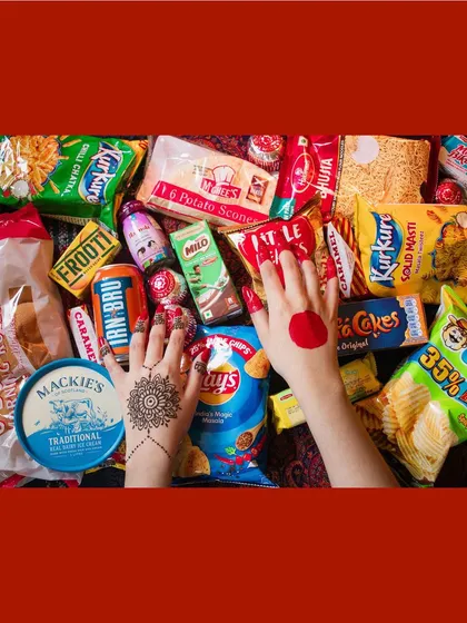 A vibrant and playful piece from the "Inheritance" exhibition, using a collection of snacks to explore cultural identity and the things that connect us across borders.