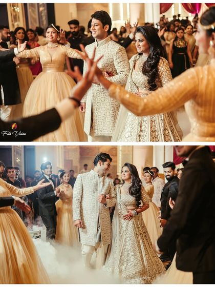 The couple's grand entrance through a corridor of dancers, surrounded by theatrical smoke. We choreograph these moments to create a spectacular visual for your film.