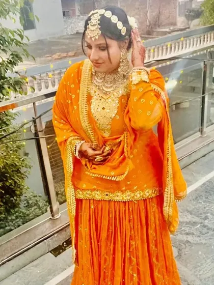 The full look for the Haldi ceremony, showing the flowy sharara and the complete set of matching jewellery.