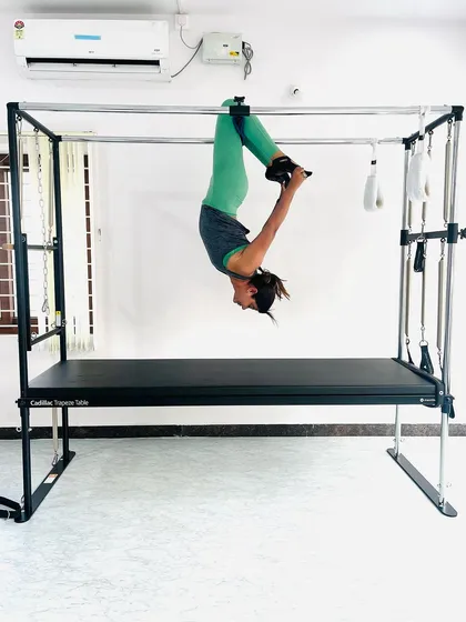 A full body inversion on the Cadillac, a fantastic way to decompress the spine and improve circulation.