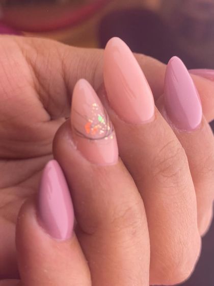 Simple elegance for a special day. This design features a mix of soft pink shades with a single accent nail showcasing a subtle touch of iridescent glitter.