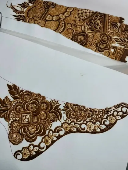 Two different styles of foot designs shown together. One is a full-coverage floral piece, while the other is a more open, flowing design, showcasing the range you will learn.
