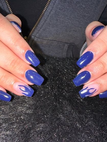 Bringing the heat with this flame nail art. I used a bold blue polish as the base and added subtle, translucent flame designs on a few accent nails for an edgy yet cool effect.