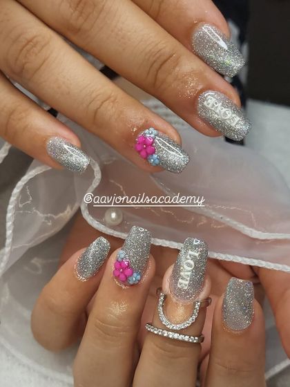 The complete look for this beautiful bridal nail set. The coffin-shaped nails are covered in reflective silver glitter, perfect for catching the light during wedding festivities.